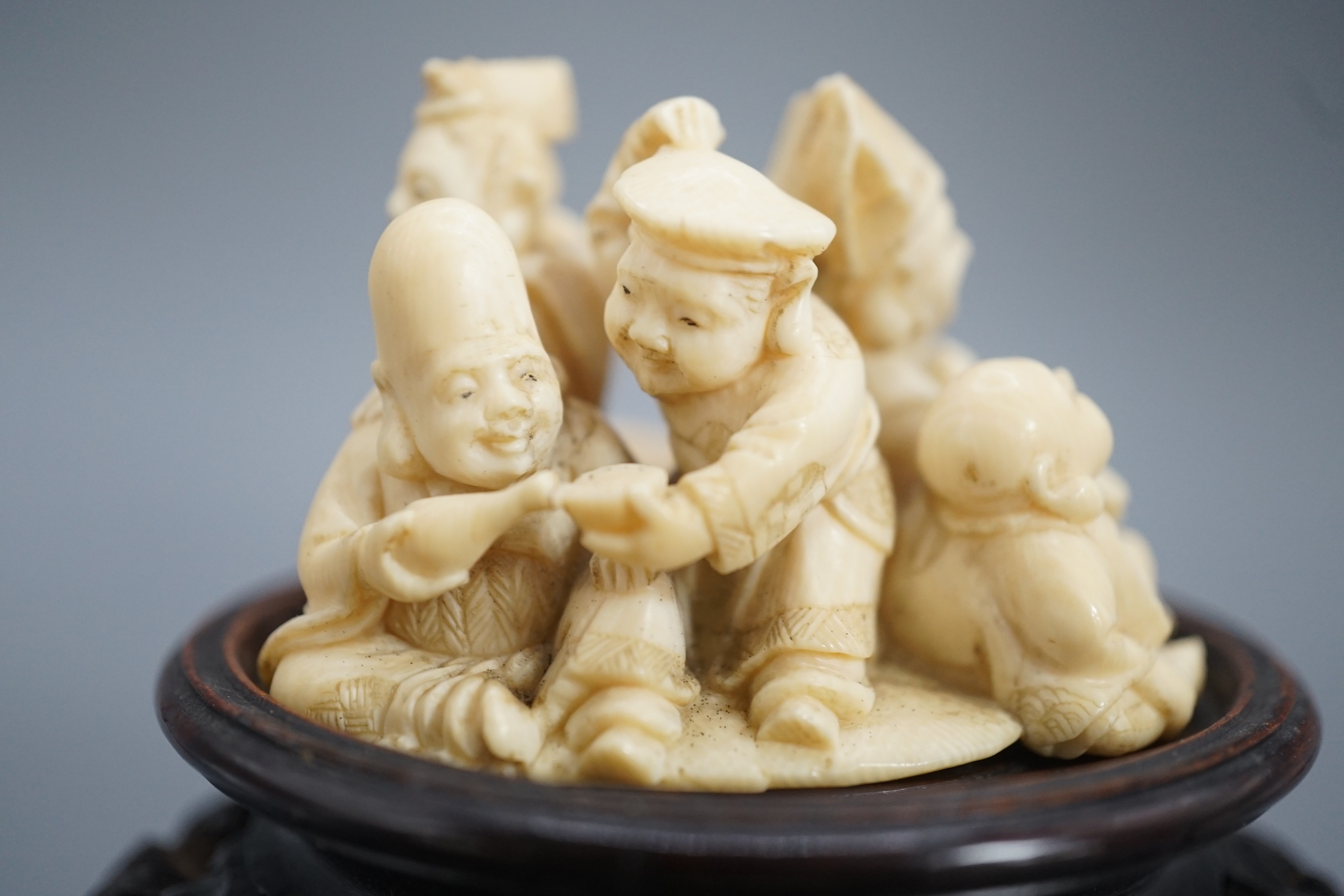 A Japanese ivory okimono of four of the Gods of Happiness, signed Gyokuzan, early 20th century, 6cm